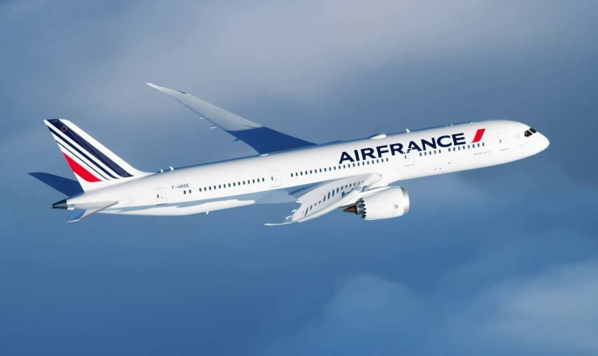 Flying Air France Boeing 787 Over The Clouds Background