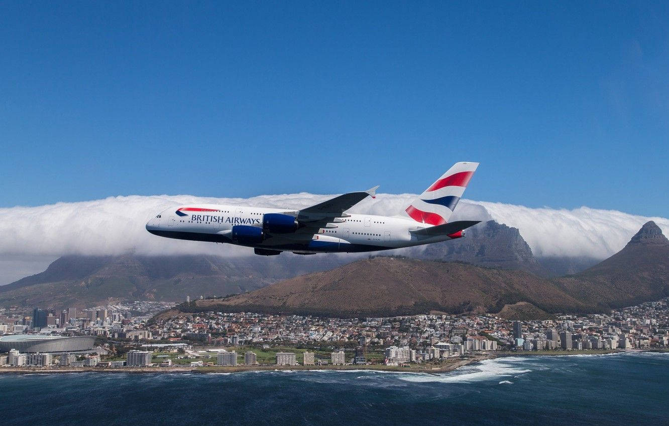 Flying Airbus From British Airways Over Mountains Background