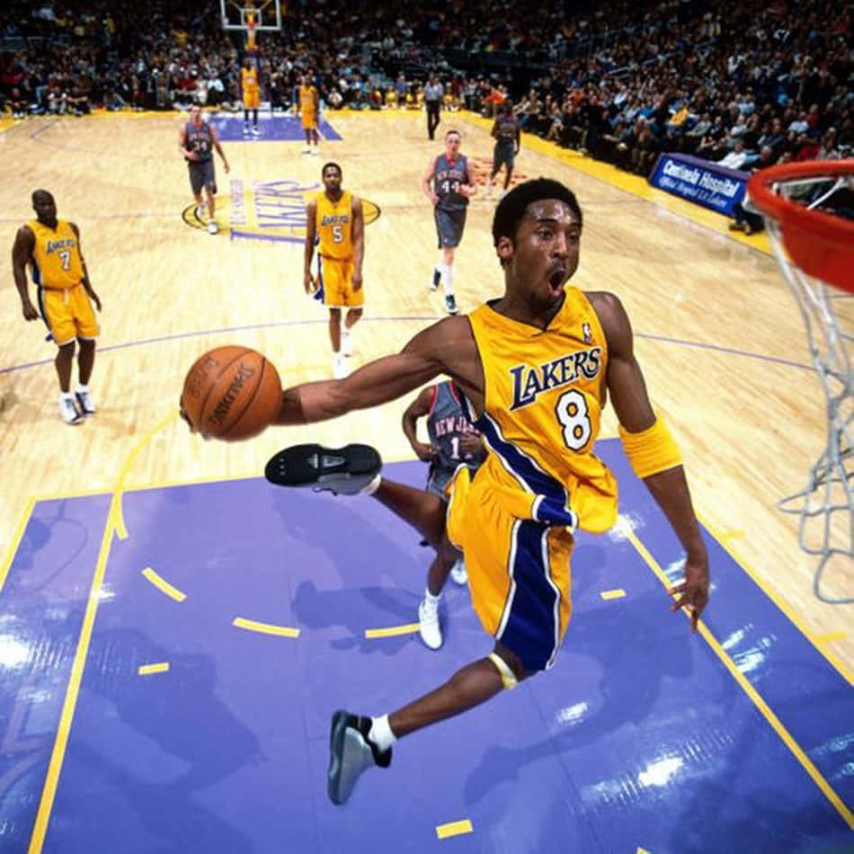 Flying High: Kobe Bryant's Legendary Dunk Background