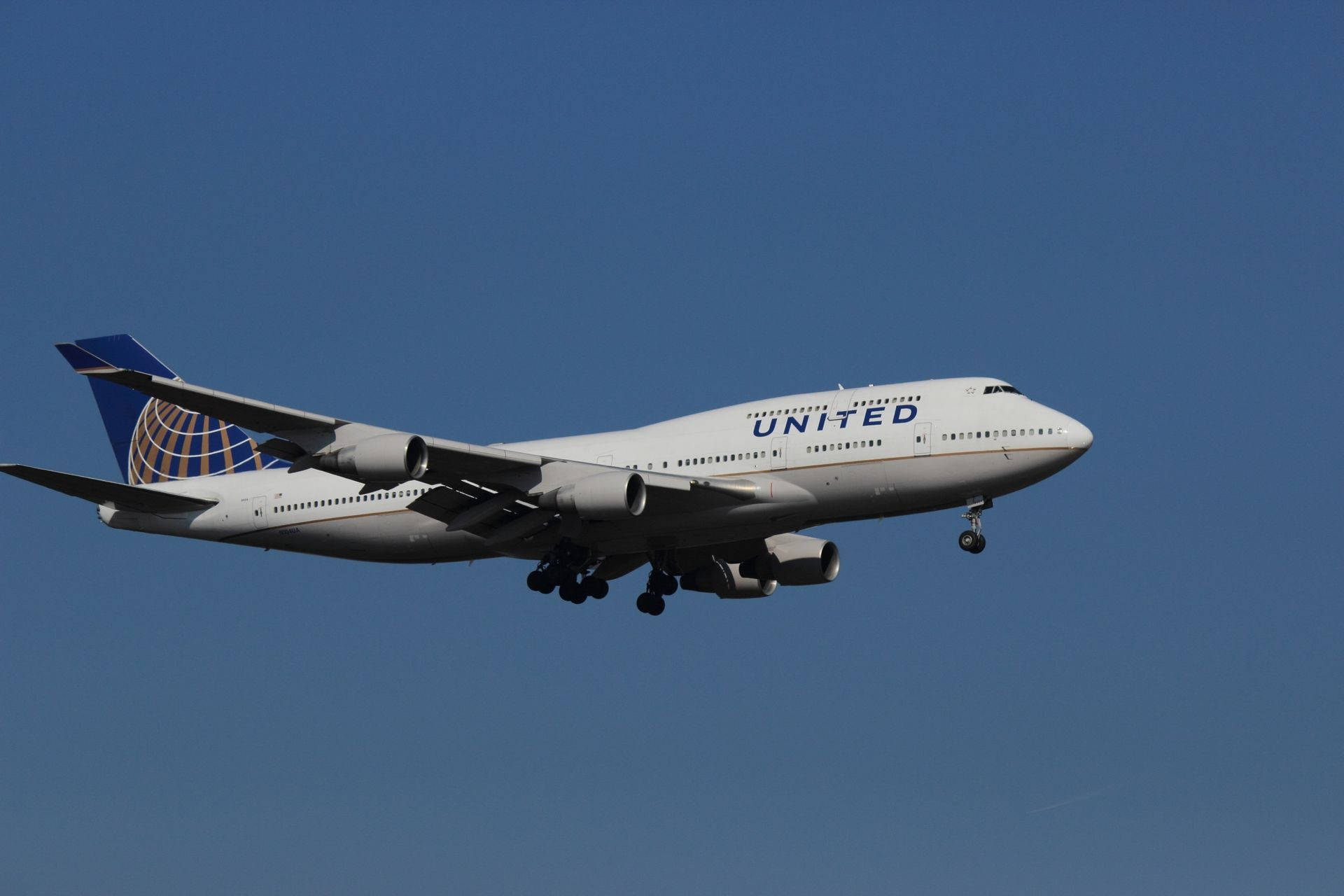 Flying Light Gray United Airplane Background