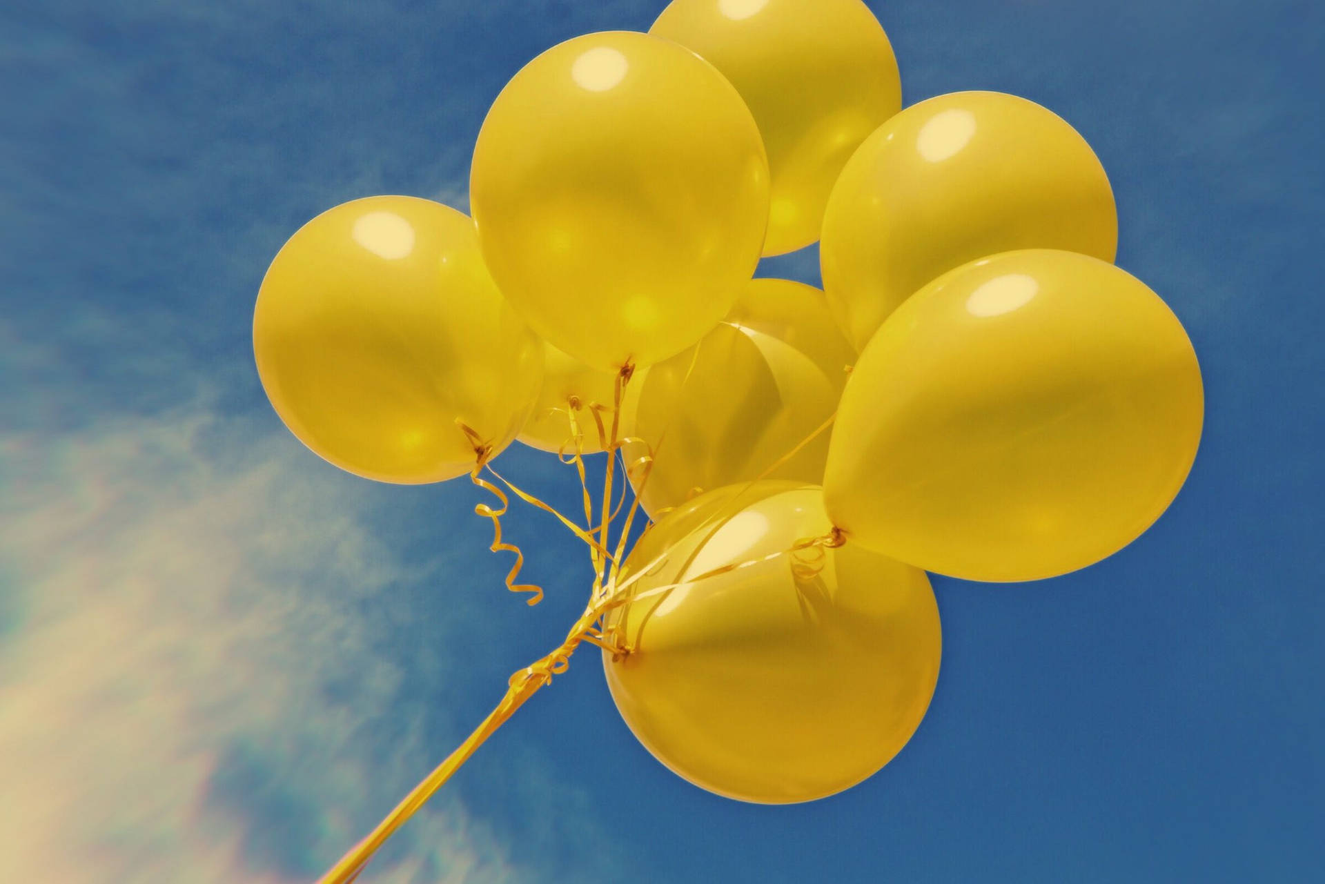 Flying Neon Yellow Balloons