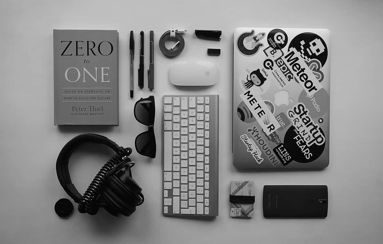 Focus On The Music With A Laptop And Headphones Background