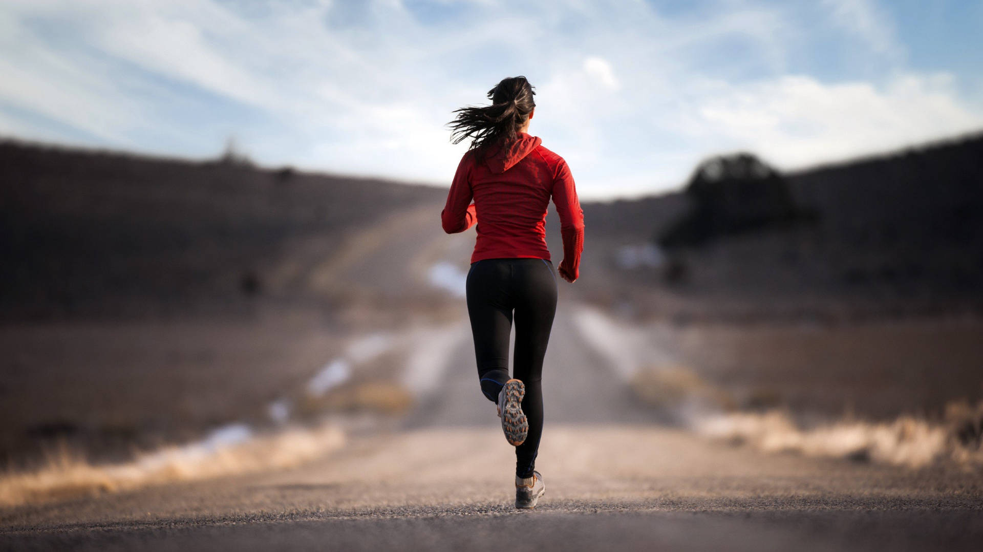 Focus Running Woman In Road Background