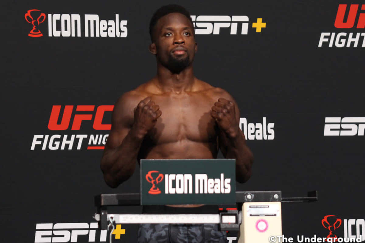 Focused And Ready - Sodiq Yusuff In Fight Stance Background