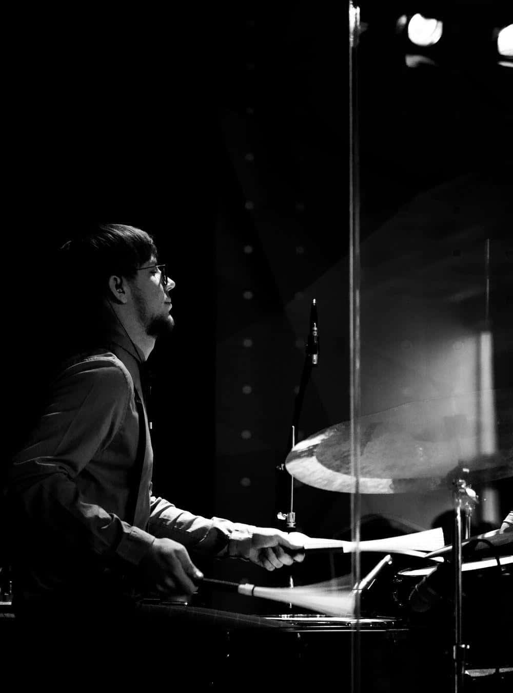 Focused Drummerin Blackand White Background