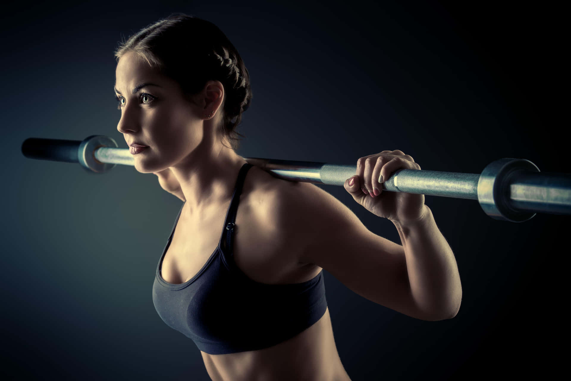 Focused Female Athlete Barbell Workout