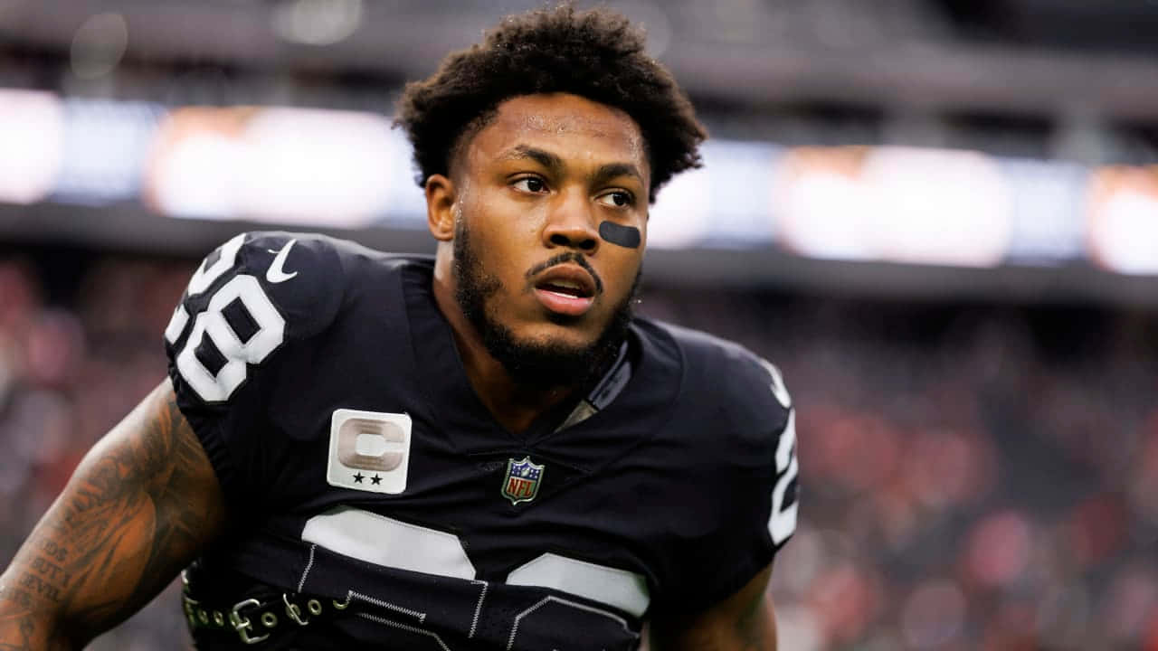 Focused Football Player Number28 Background