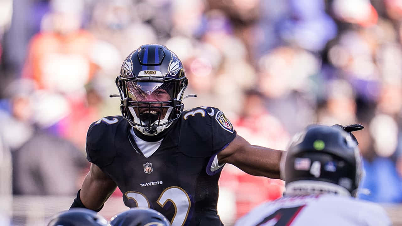 Focused Football Player Readyfor Action