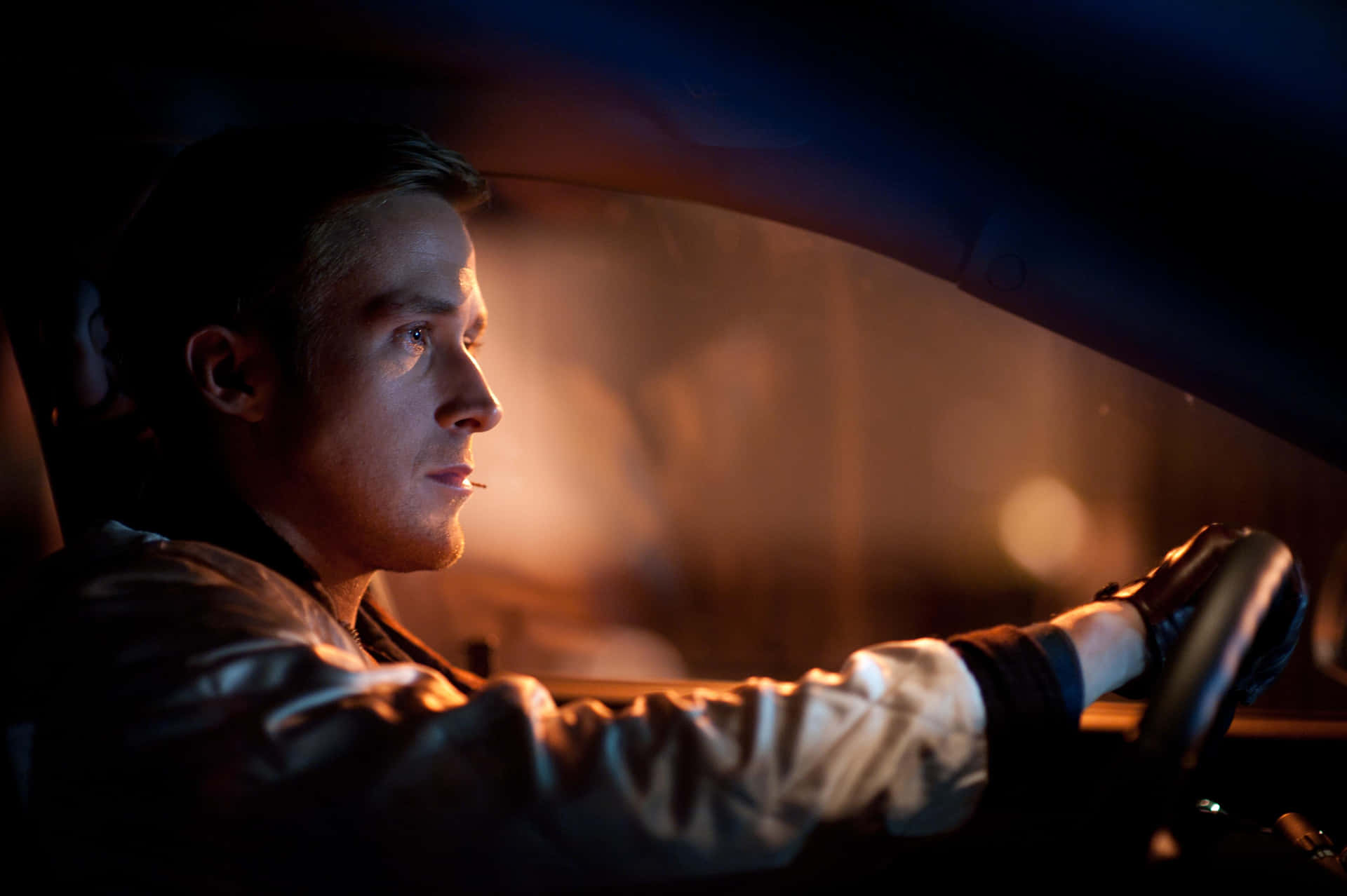 Focused Man Drivingat Night Background