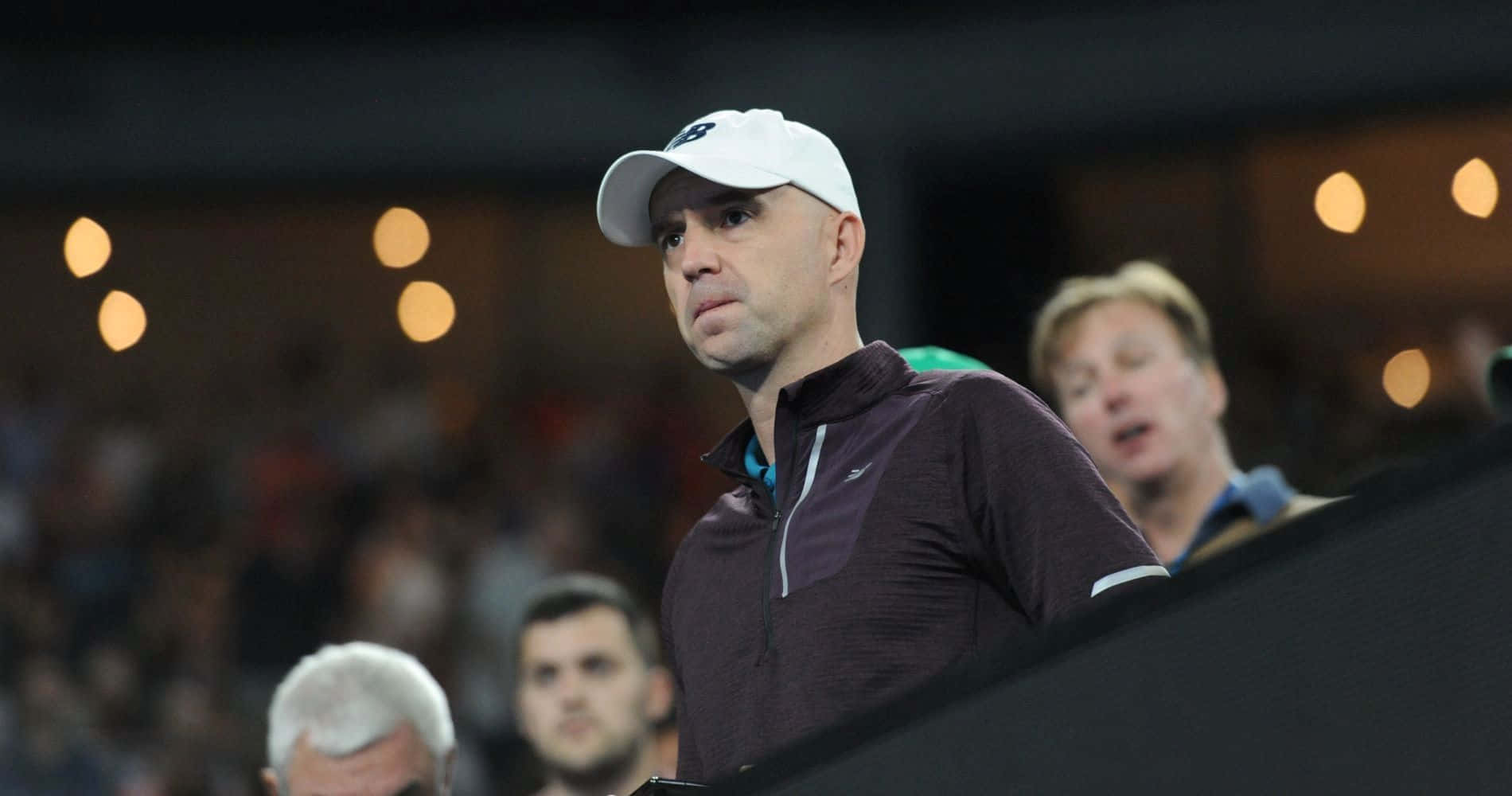 Focused Tennis Coachat Court Side