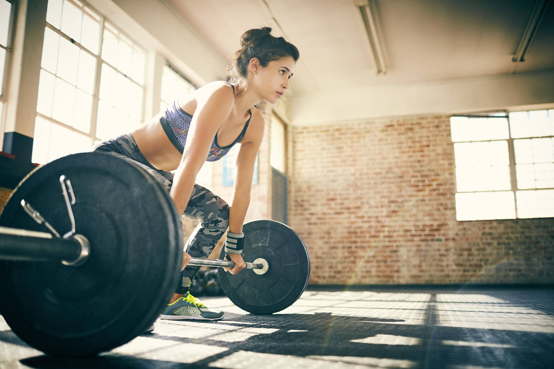 Focused Woman With Barbell Background