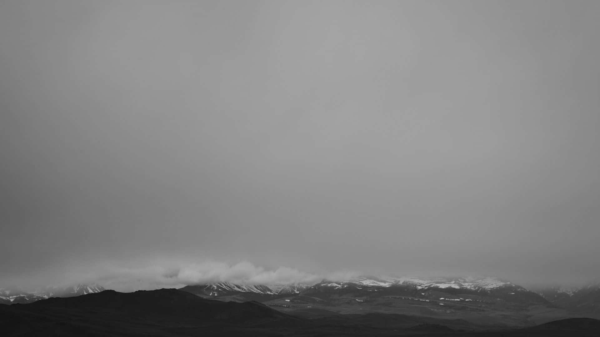 Foggy Mountain Range In Grey Desktop Background