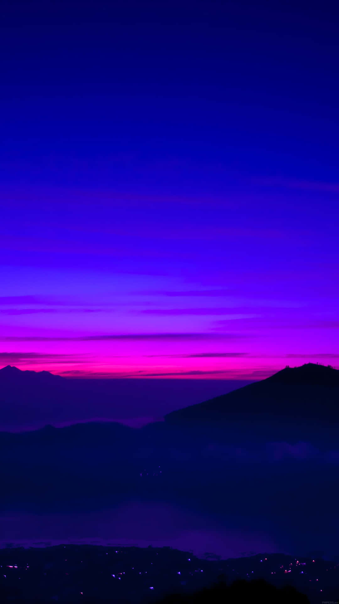 Foggy Mountains On A Blue And Purple Sunset Background