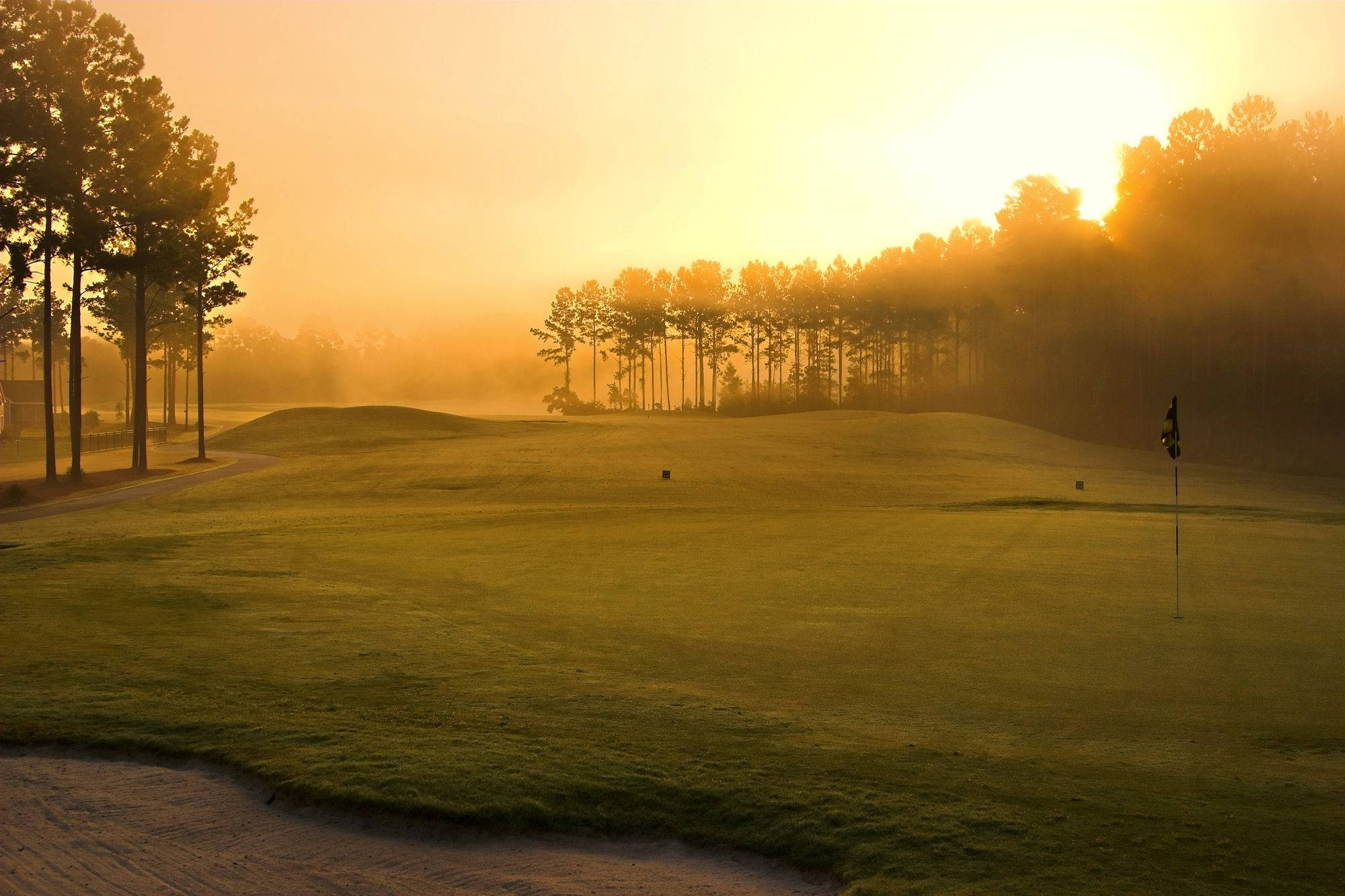 Foggy Sunset On Cool Golf Course Background