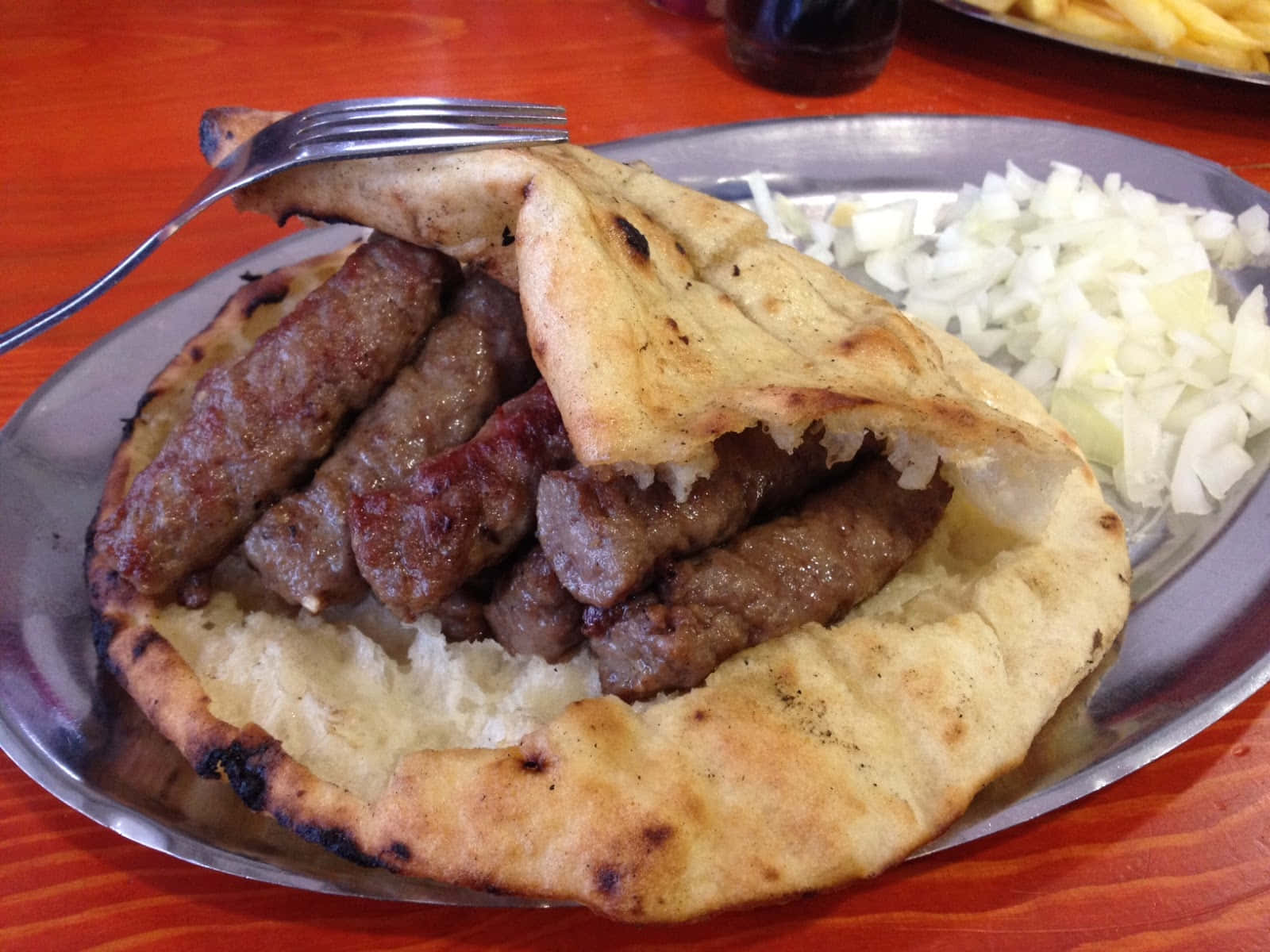 Folded Pita Bread With Ćevapi Sausages Background