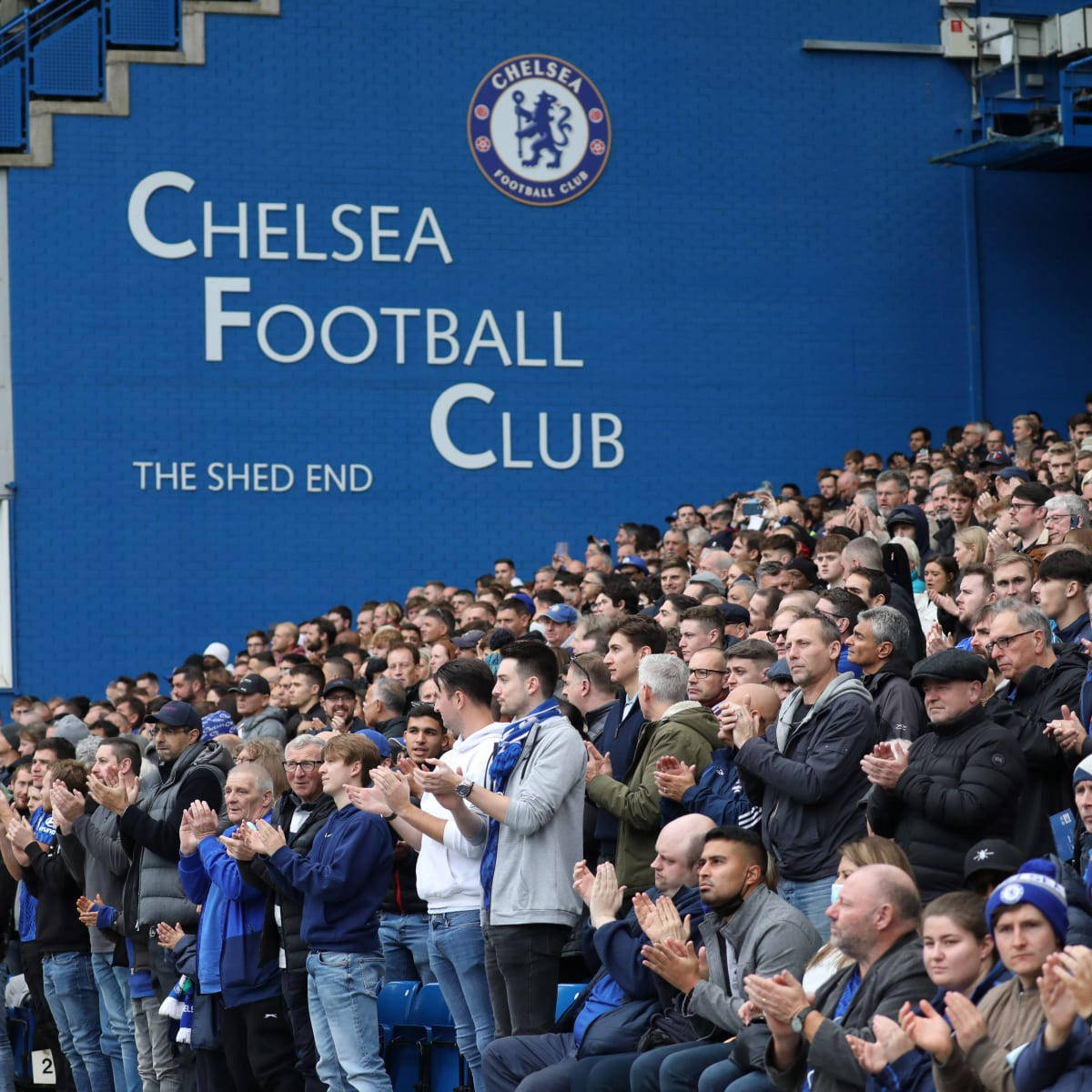 Football Fans In Stamford Bridge Background