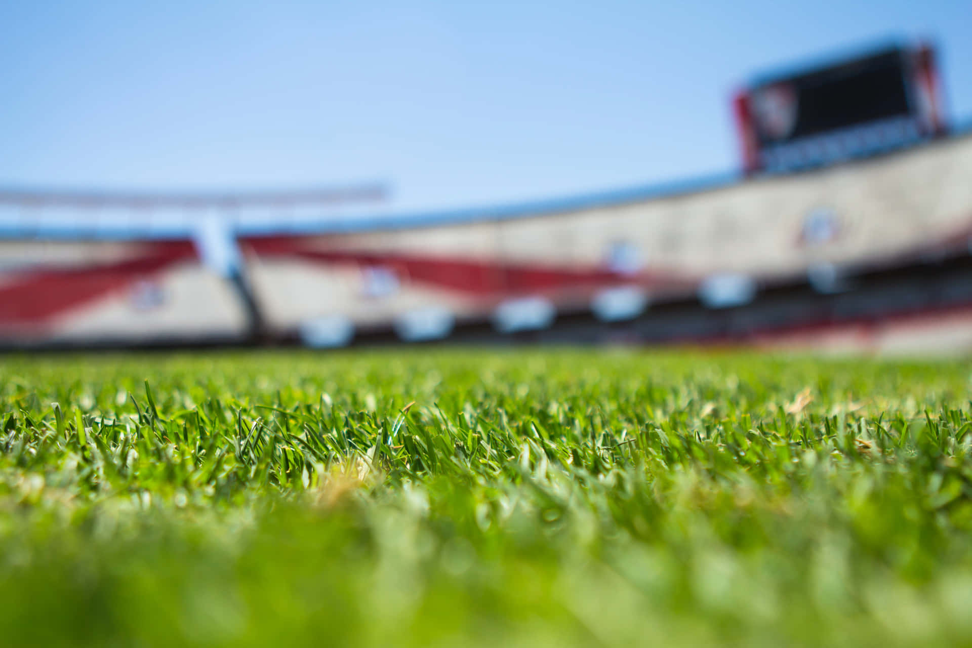 Football Field Focus With Bleachers Background