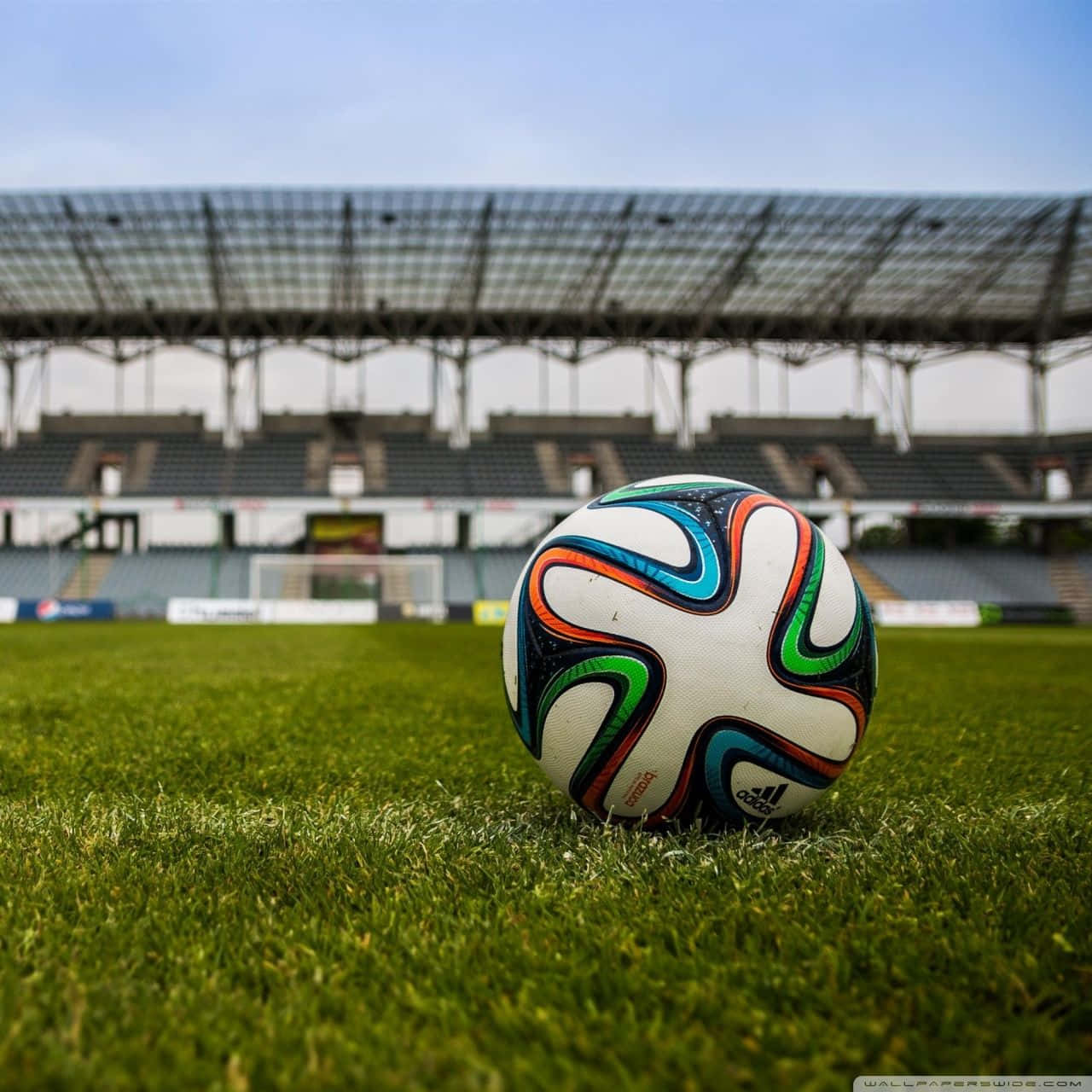 Football Galaxy Ball On Stadium Grassy Ground Background