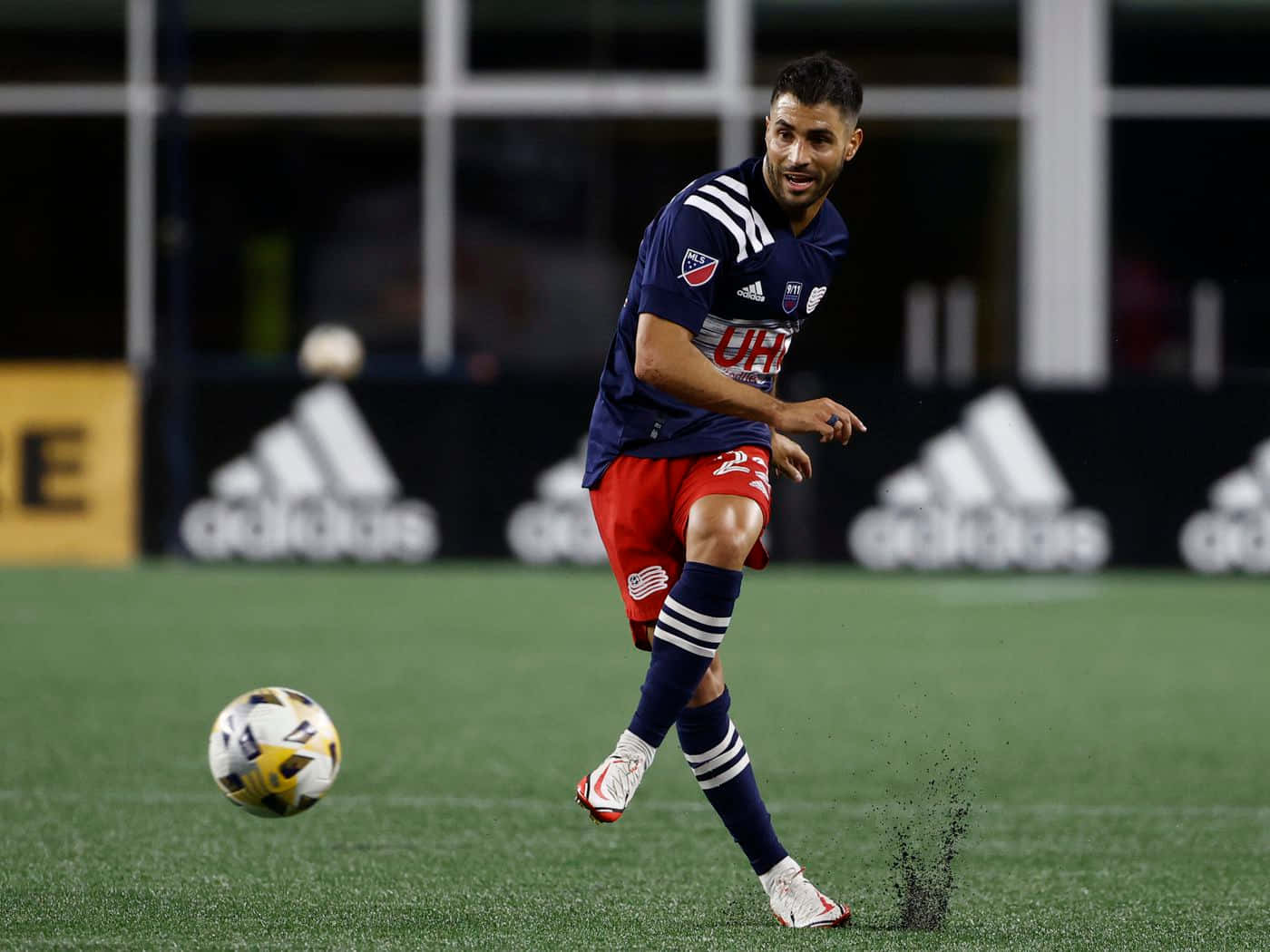 Football Player Carles Gil Passing The Ball Background