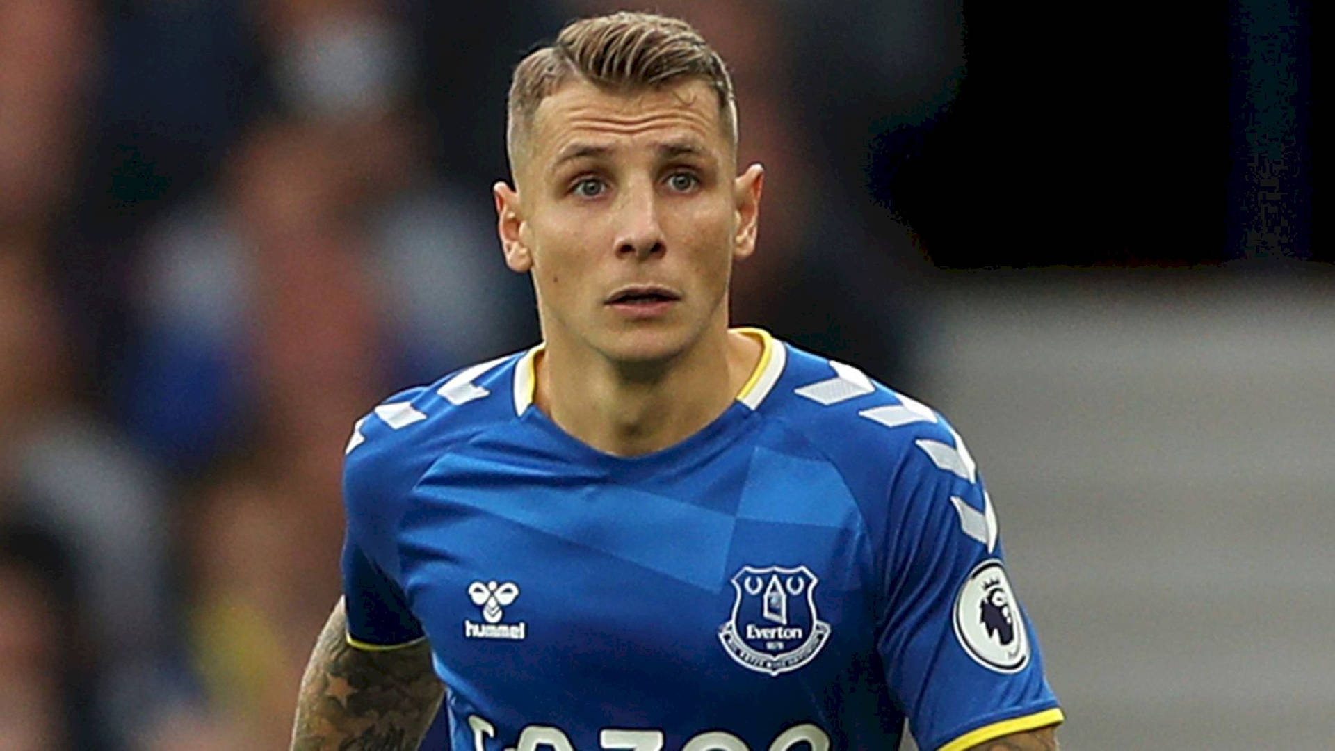 Football Player Lucas Digne Looking Up Background