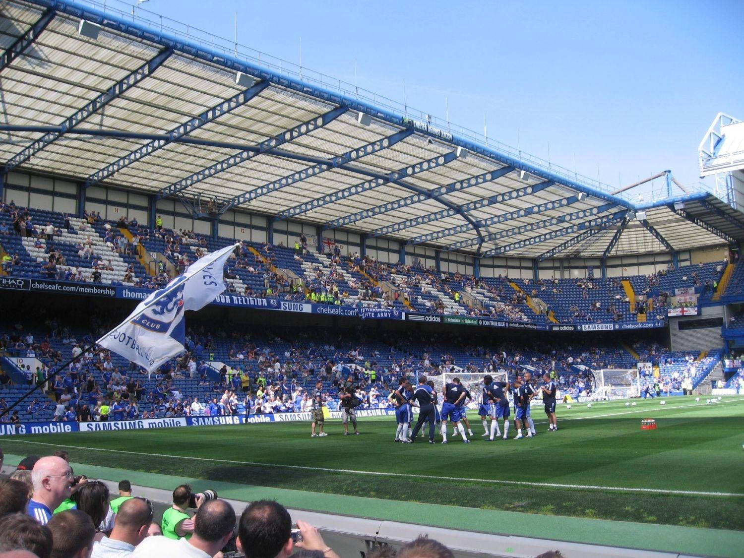 Football Players In Stamford Bridge Background