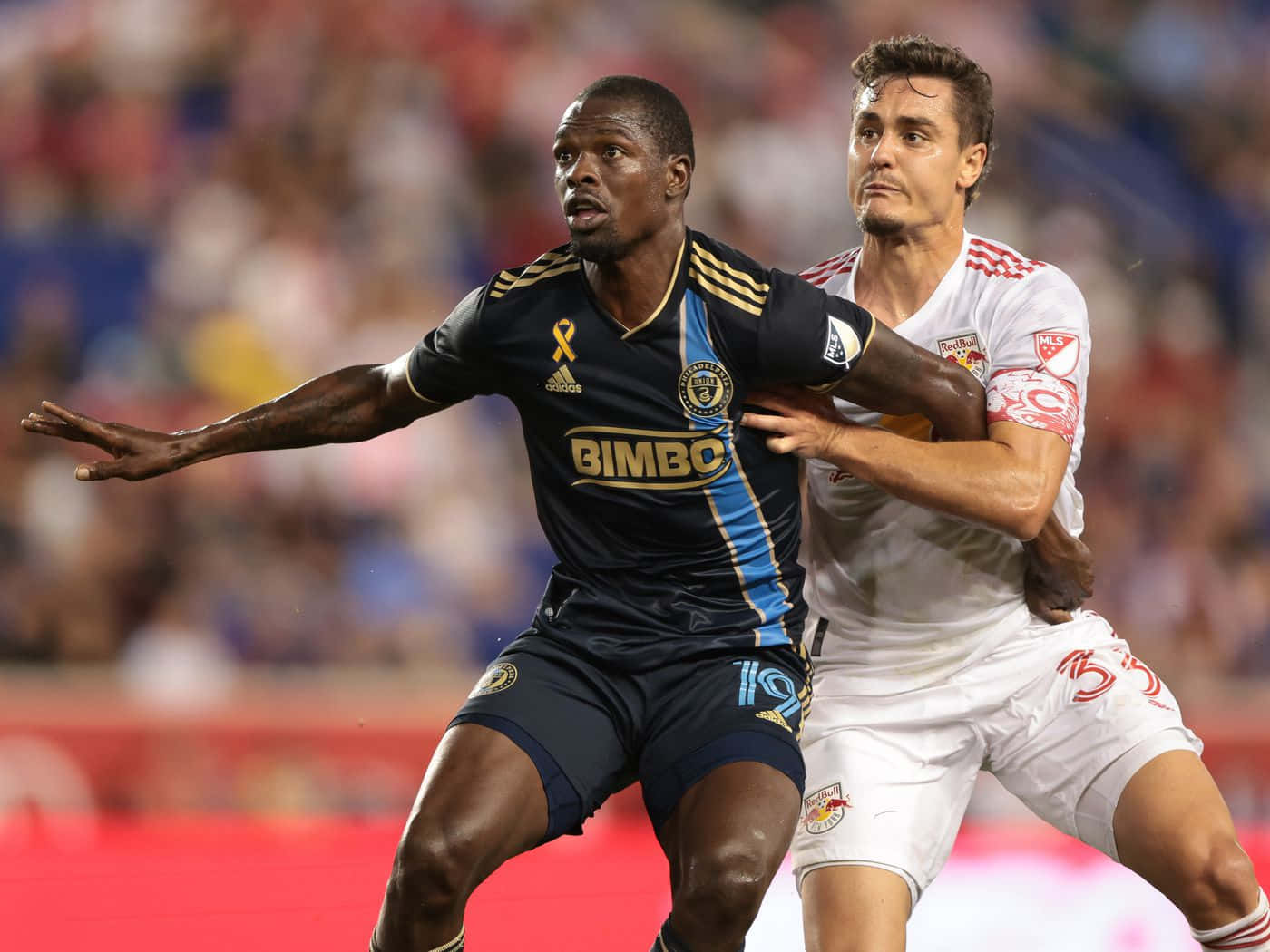 Footballer Aaron Long In Action Against Cory Burke Background