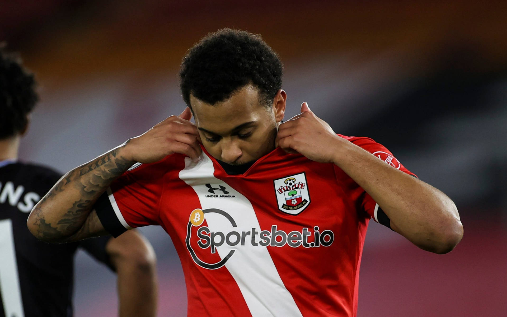 Footballer Adjusting Jersey Background