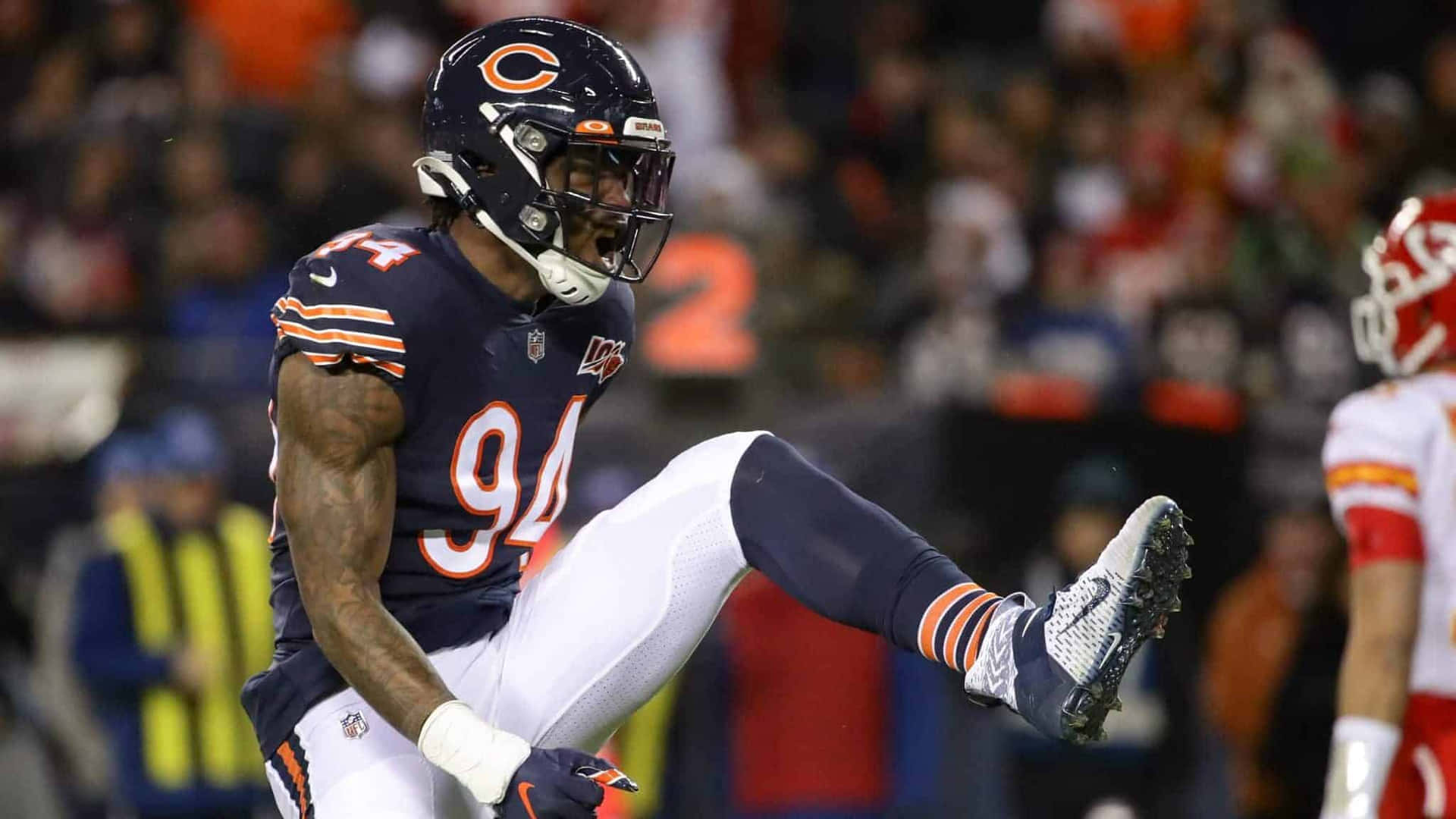 Footballer Leonard Floyd Celebrating And Shouting Background
