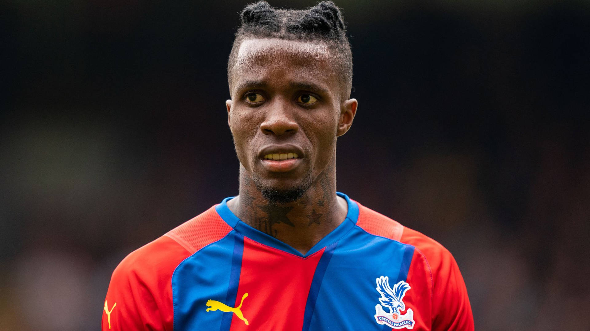 Footballer Wilfried Zaha Sporting Intricate Braids Hairstyle.