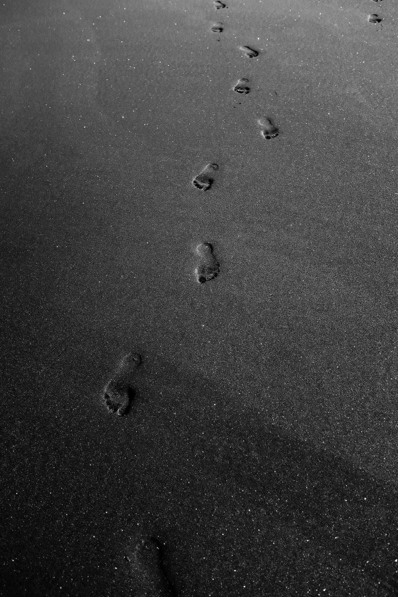 Footprints On Sand Black Phone Background