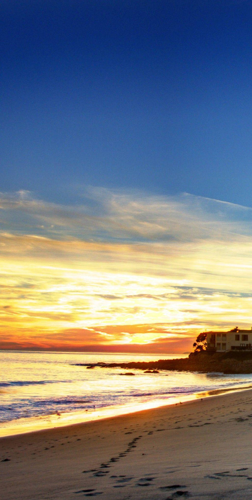 Footprints On Shores Of Malibu Beach Background