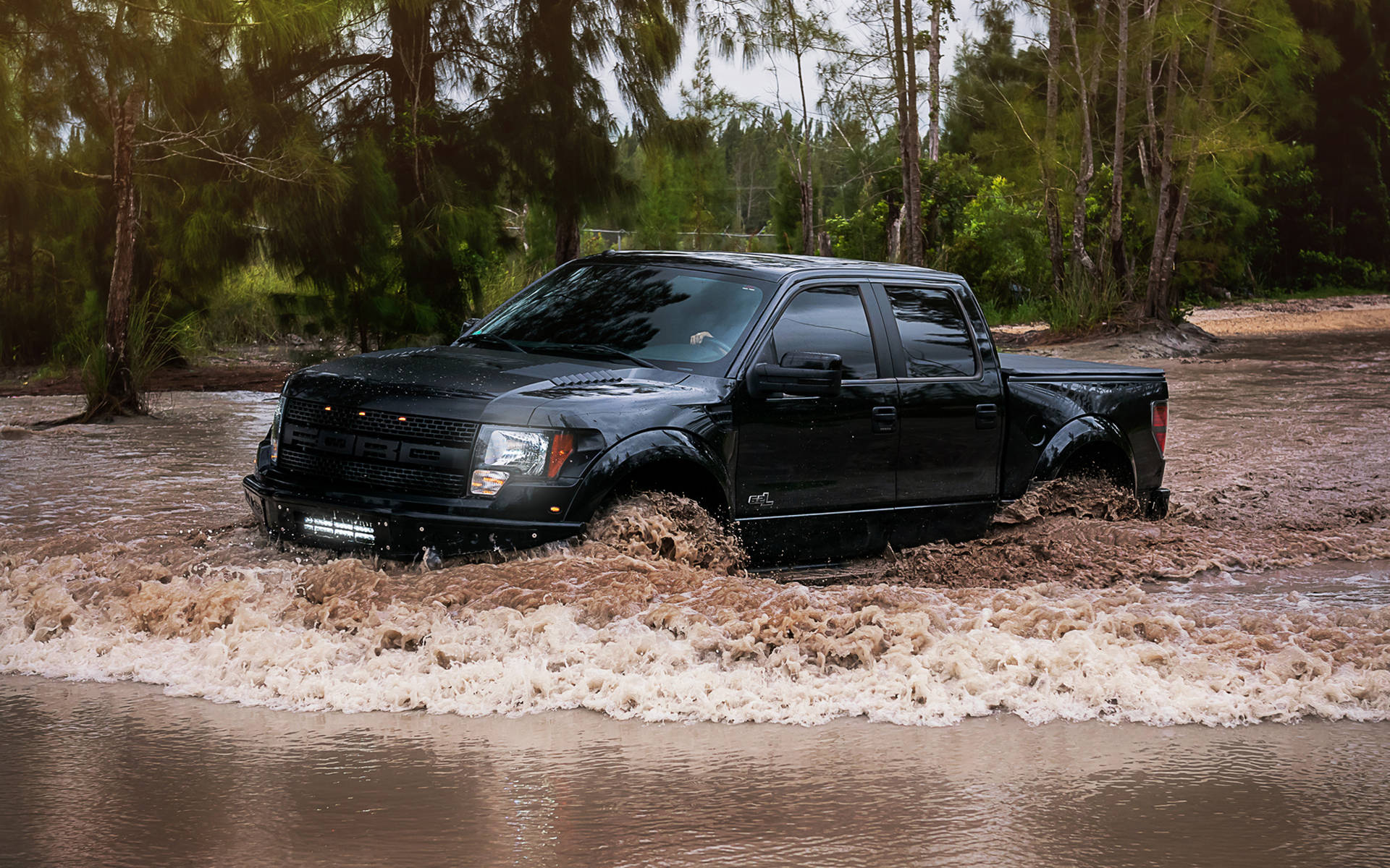 Ford Raptor Crossing A Muddy Flood