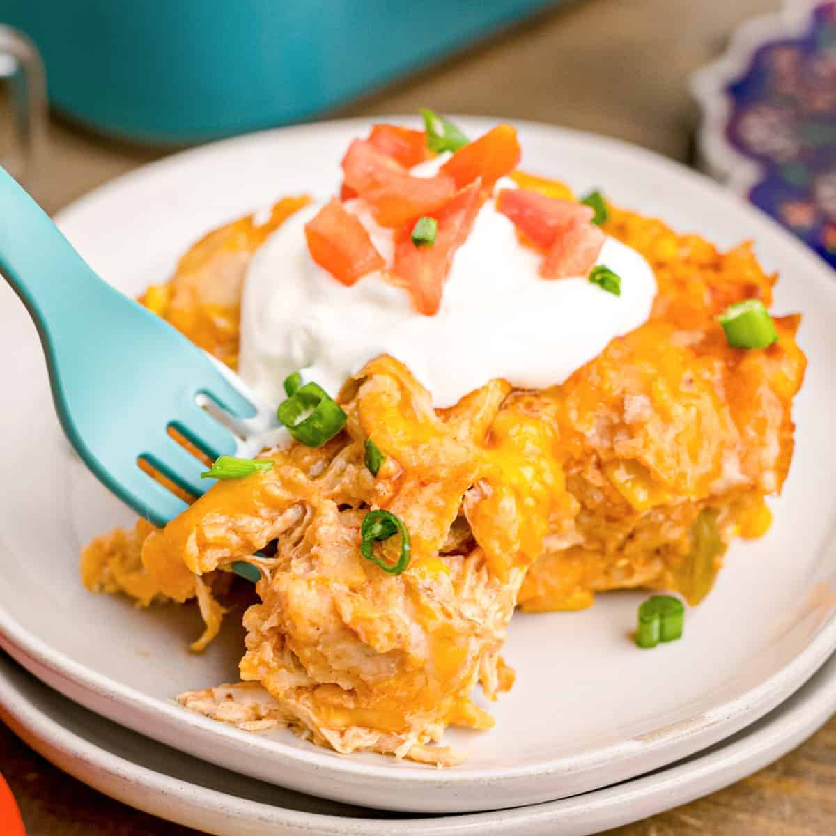 Fork Scooping Enchiladas On Plates Background