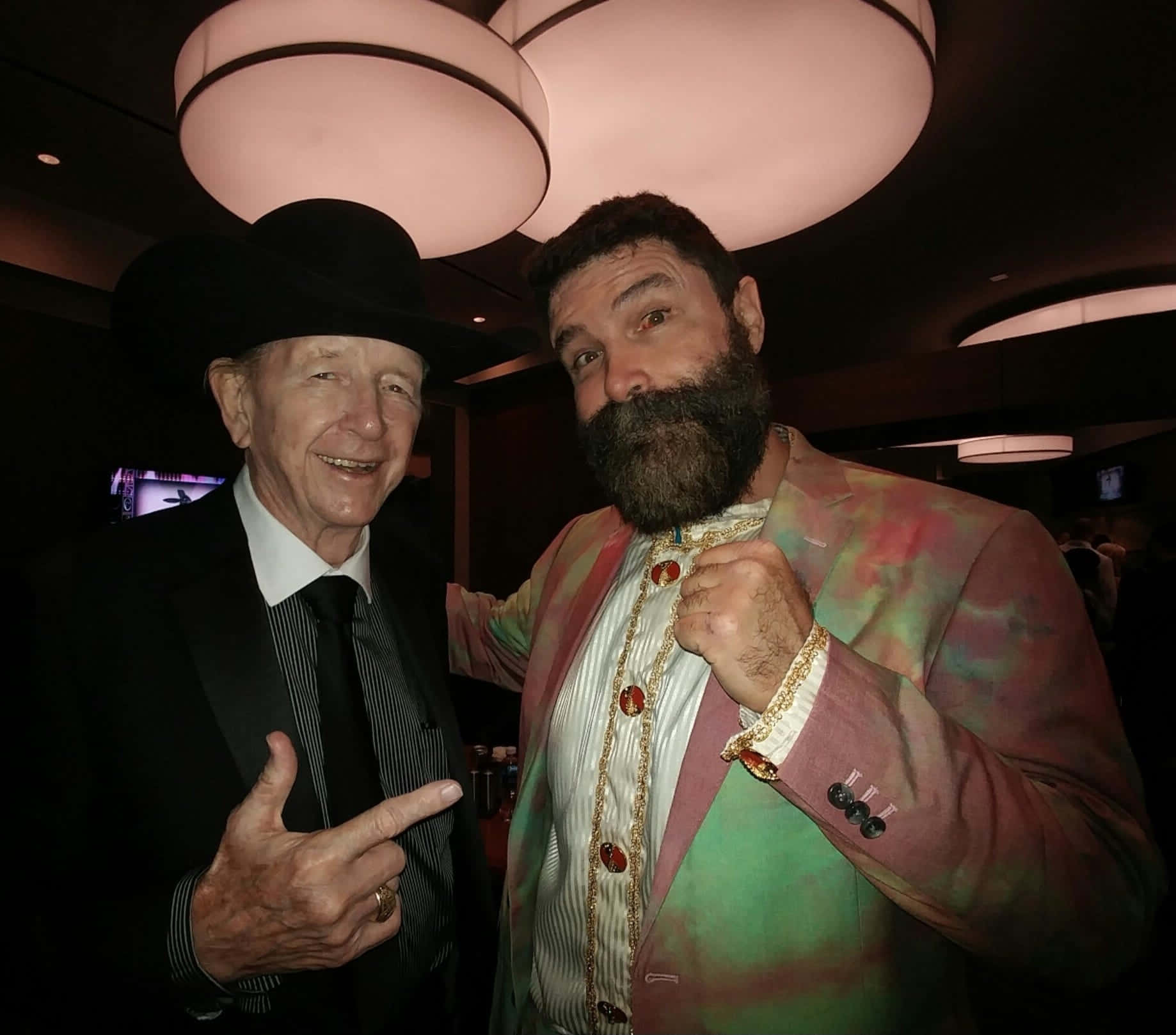 Former American Wwe Wrestler Mick Foley With Dory Funk Jr Background