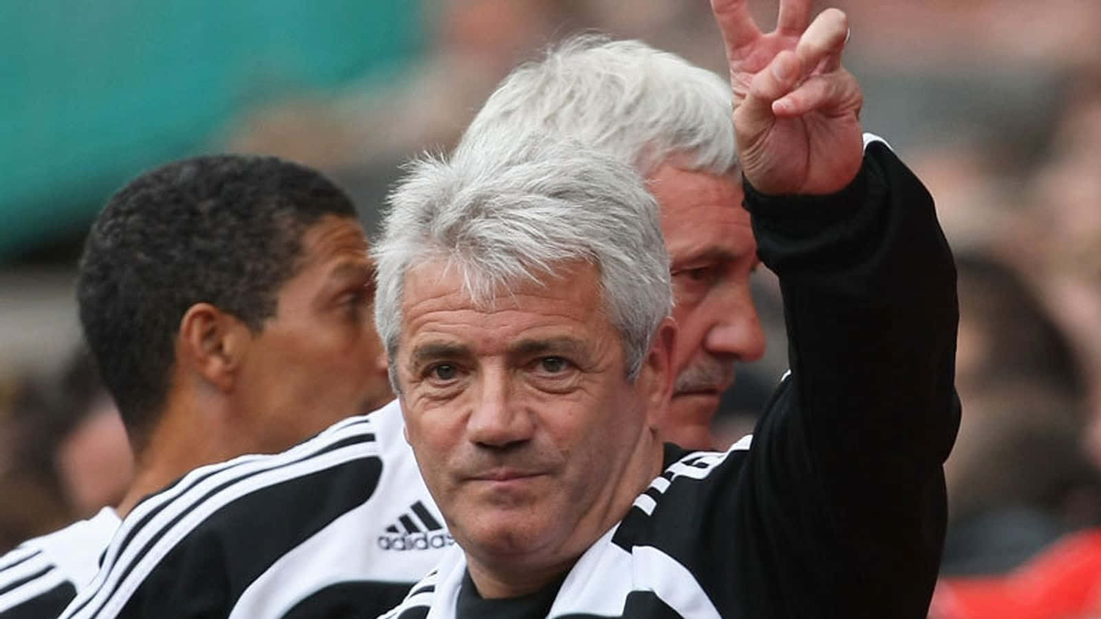 Former Footballer Kevin Keegan Peace Sign Background