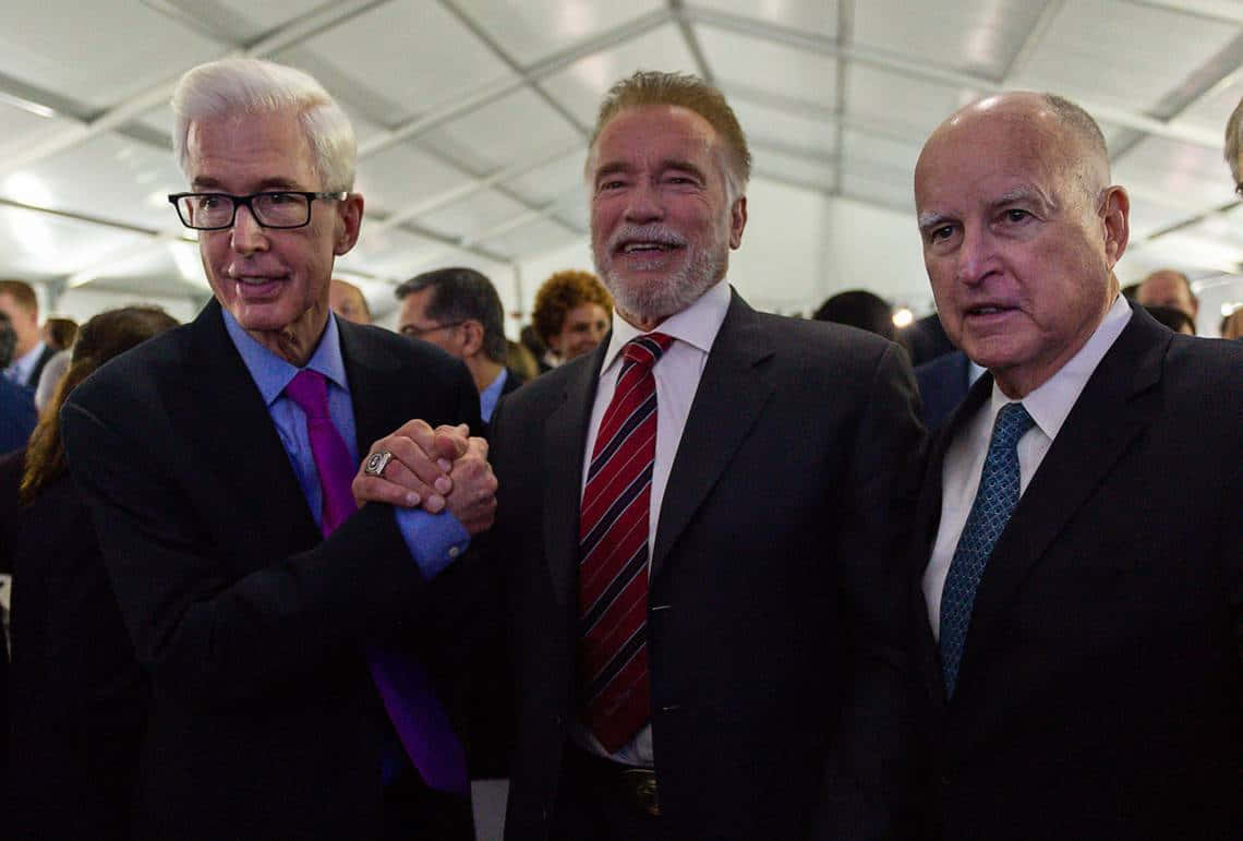 Former Governor Gray Davis Engaging With Fellow Politicians Background