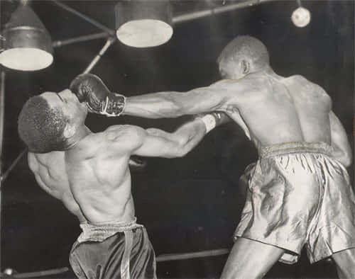 Former Lightweight Champion Ike Williams In Action Background