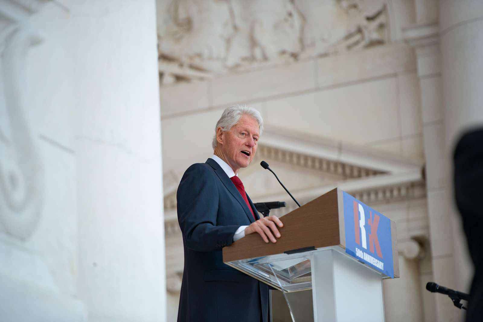 Former President Bill Clinton In A Thoughtful Moment Background