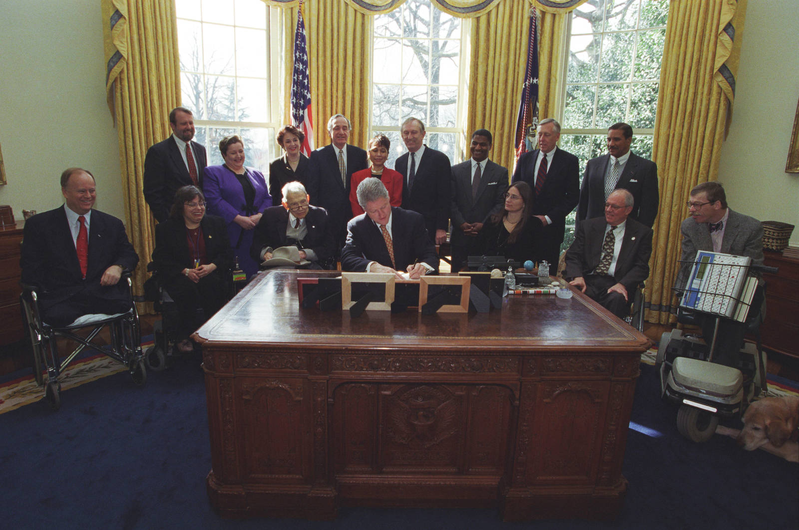 Former President Bill Clinton Signing An Agreement