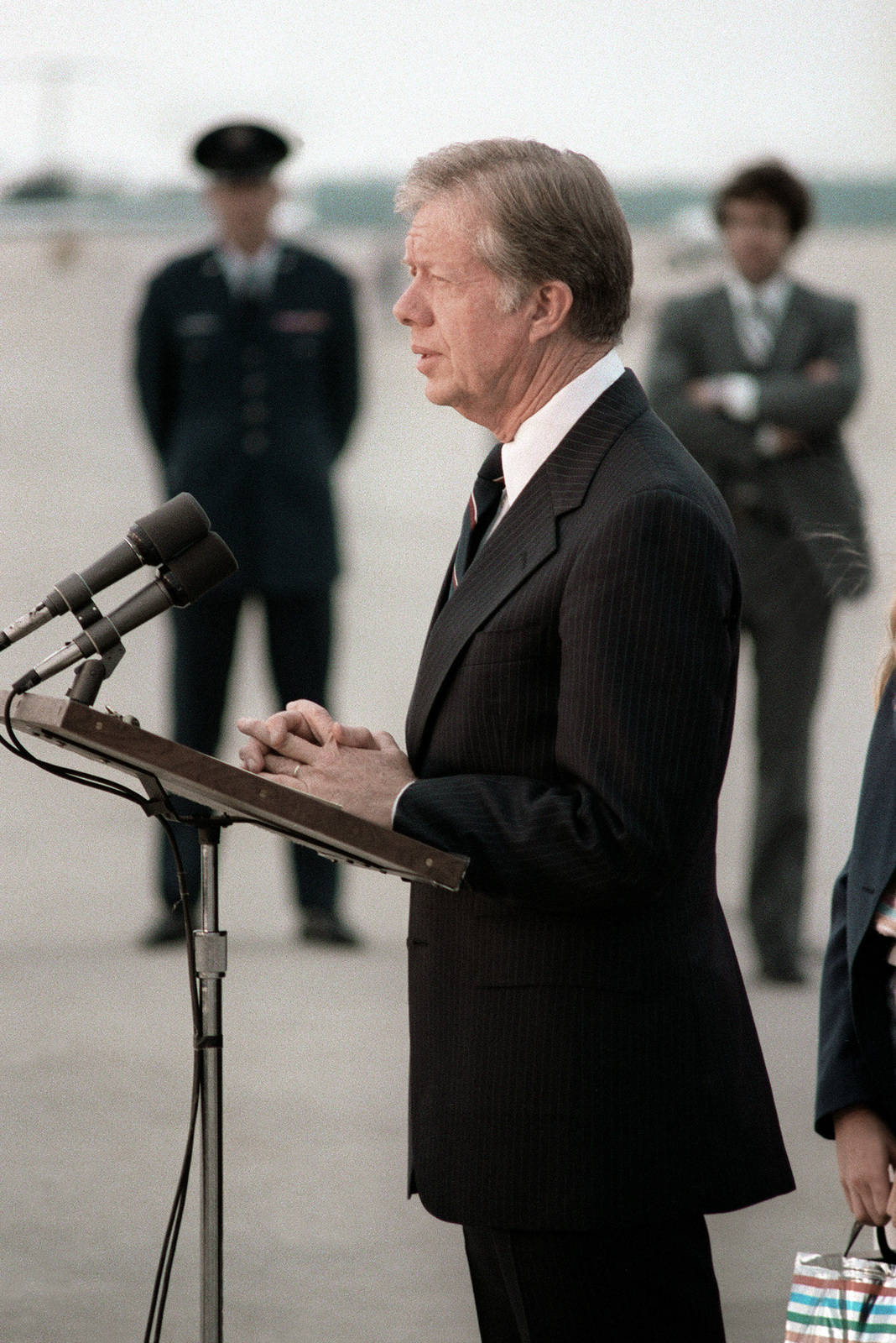 Former President Jimmy Carter Delivering A Speech Background