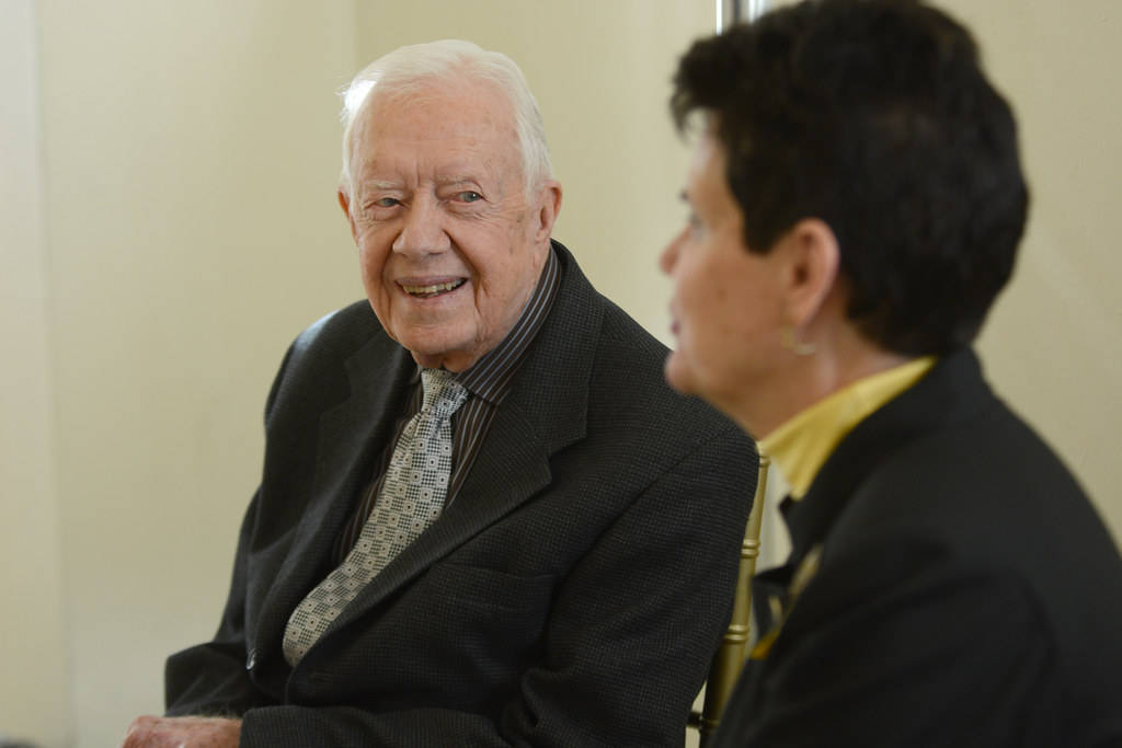 Former President Jimmy Carter Engaging In Conversation With A Woman