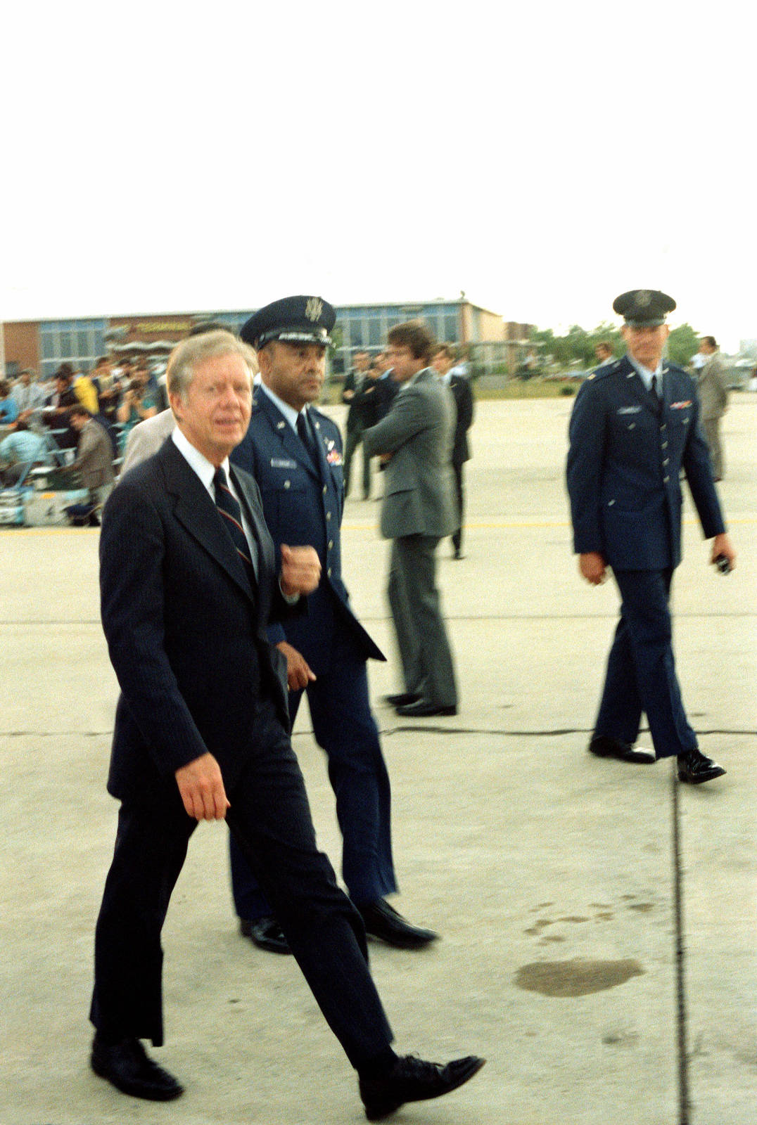 Former President Jimmy Carter Stands Proudly With The Military Force.