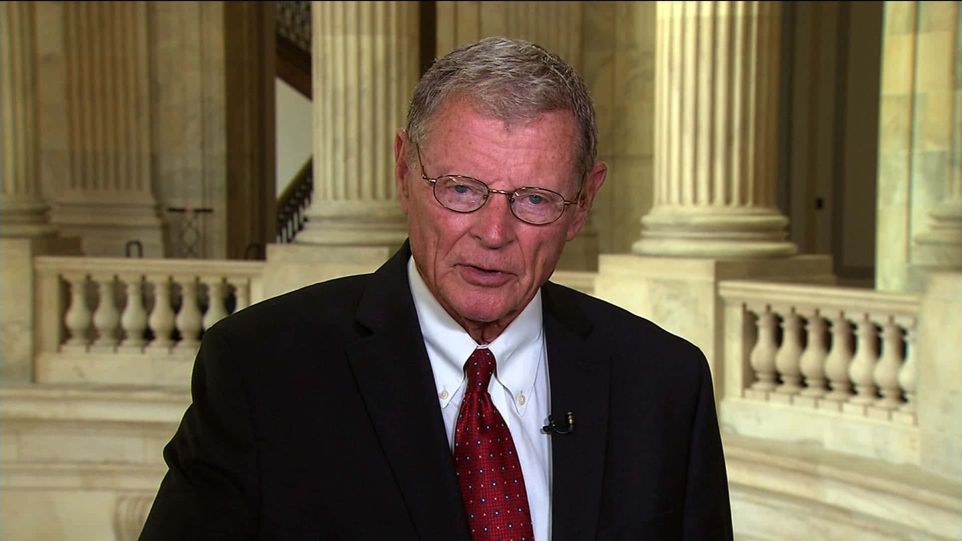Former Senator Jim Inhofe Delivering A Speech Background