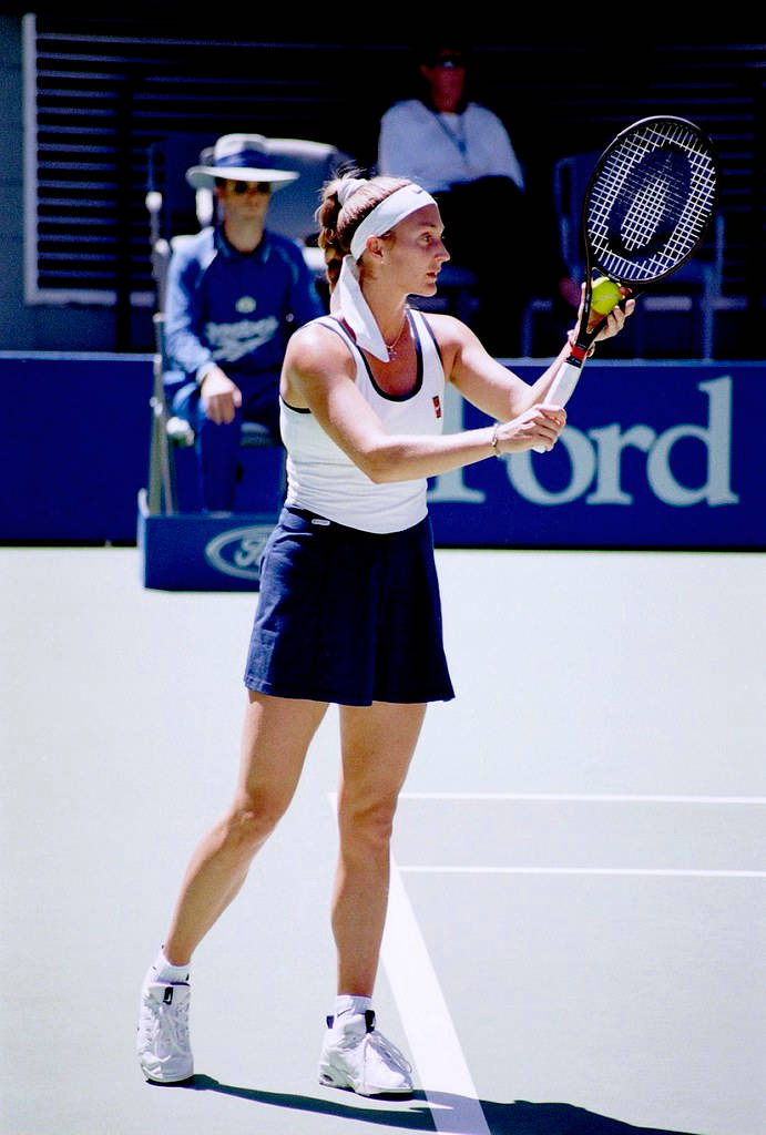 Former Tennis Star Mary Pierce Competing In White And Blue Dress Background