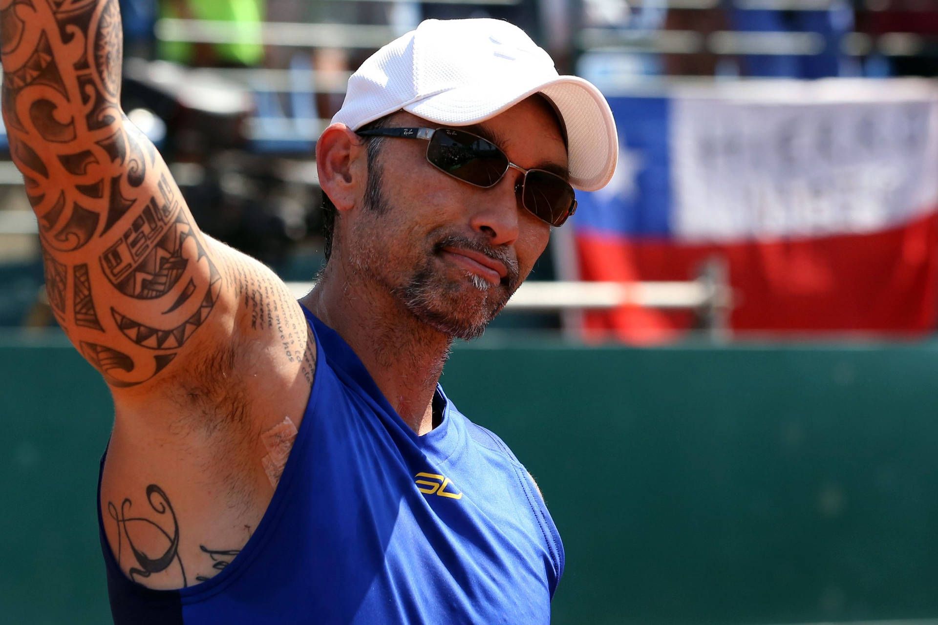 Former World No.1 Tennis Player Marcelo Ríos Flaunting Sunglasses Background