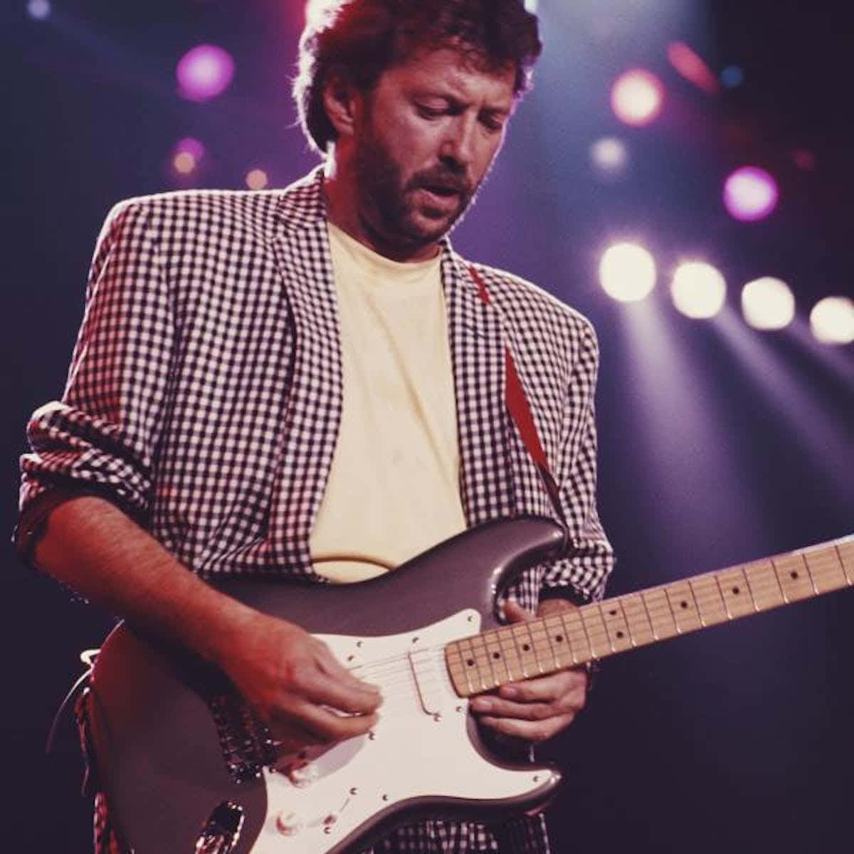 Former Yardbirds Member Eric Clapton With Guitar Background