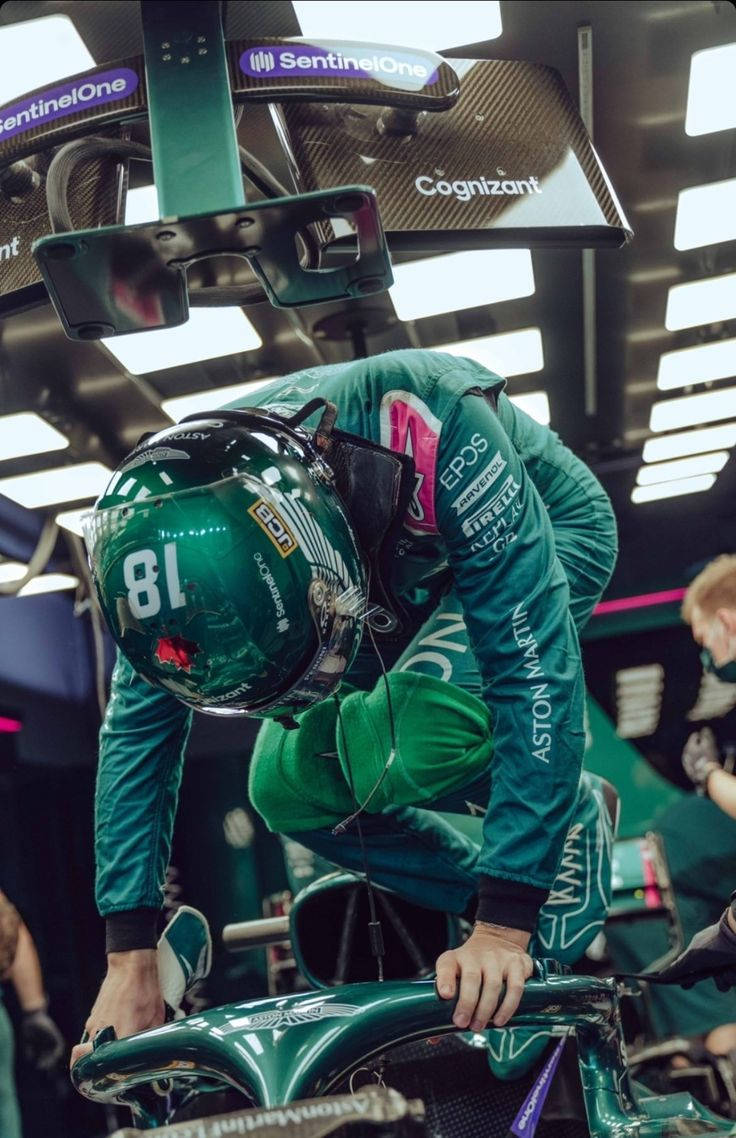 Formula 1 Driver, Lance Stroll Gearing Up To Take A Ride In His Racing Car. Background