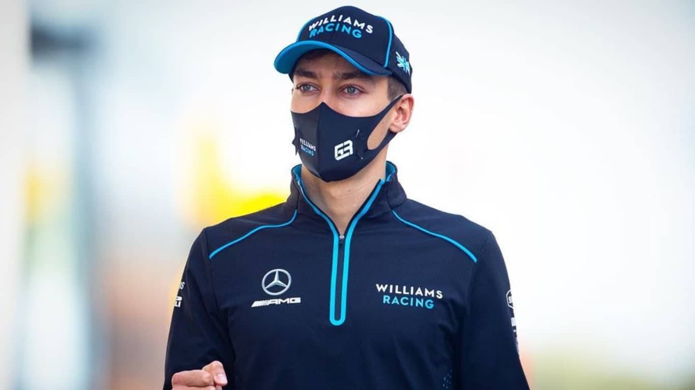 Formula 1 Racer George Russell Wearing Cap And Mask Background