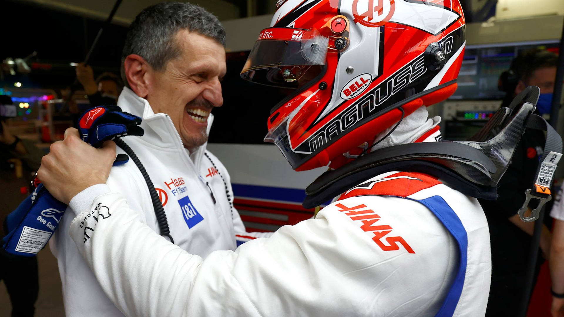 Formula One Driver, Kevin Magnussen Preparing For A Welcoming Hug With His Team Principal, Gunther Steiner. Background