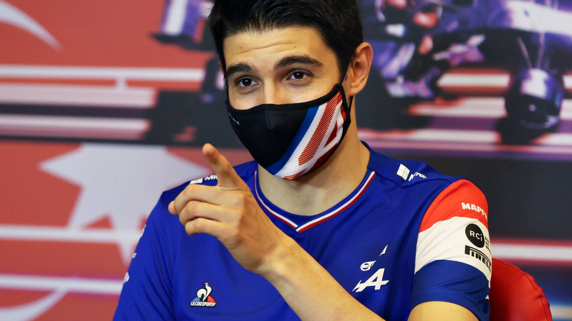 Formula One Racer Esteban Ocon Wearing A Mask Background